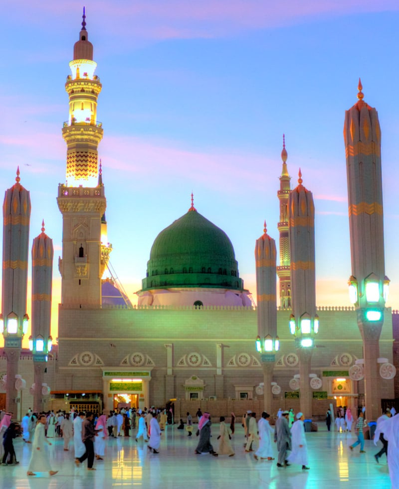 Rabi' al-Awwal — soft dawn light over Madinah-style architecture with an Islamic geometric pattern, marking the month of the Prophet's birth and migration